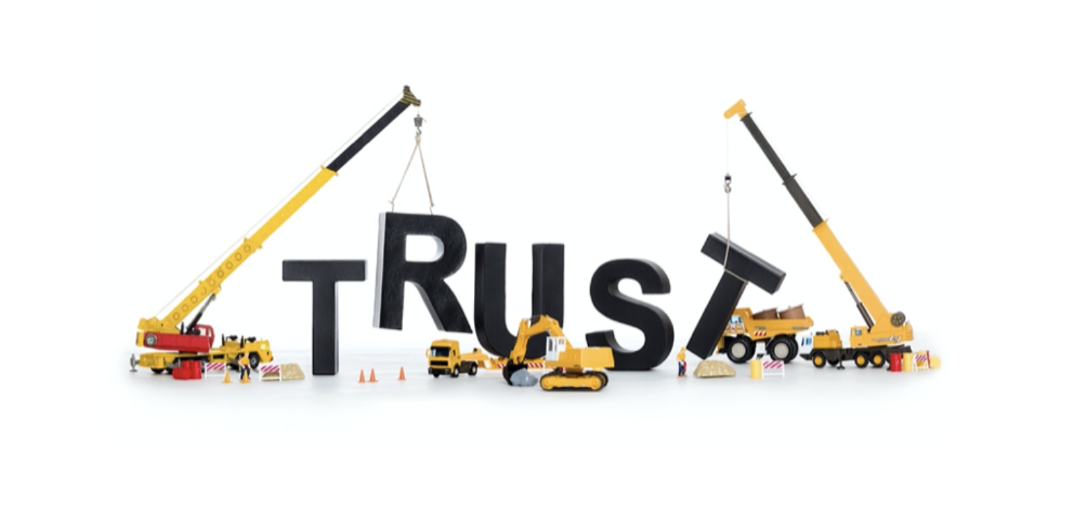 a picture of the word trust being built